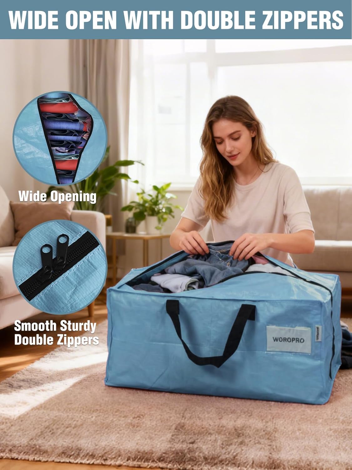 Dusty blue moving bag with double zippers and black carry handles; open wide.