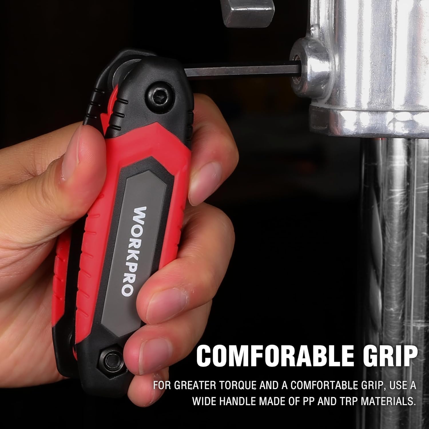 WORKPRO folding hex key set with red and black handle, held in a hand for grip
