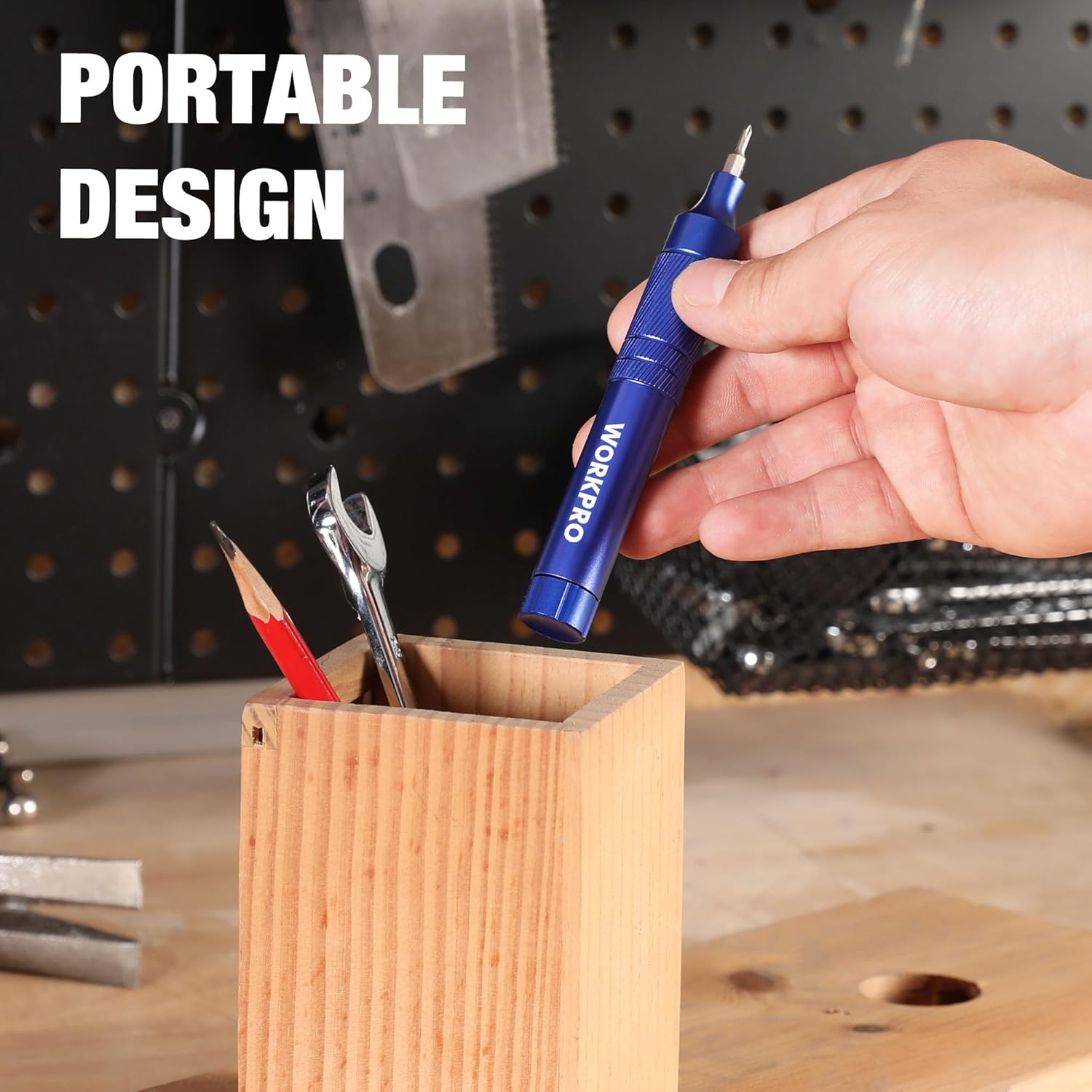 Blue WORKPRO portable pen screwdriver held ready with bit tips