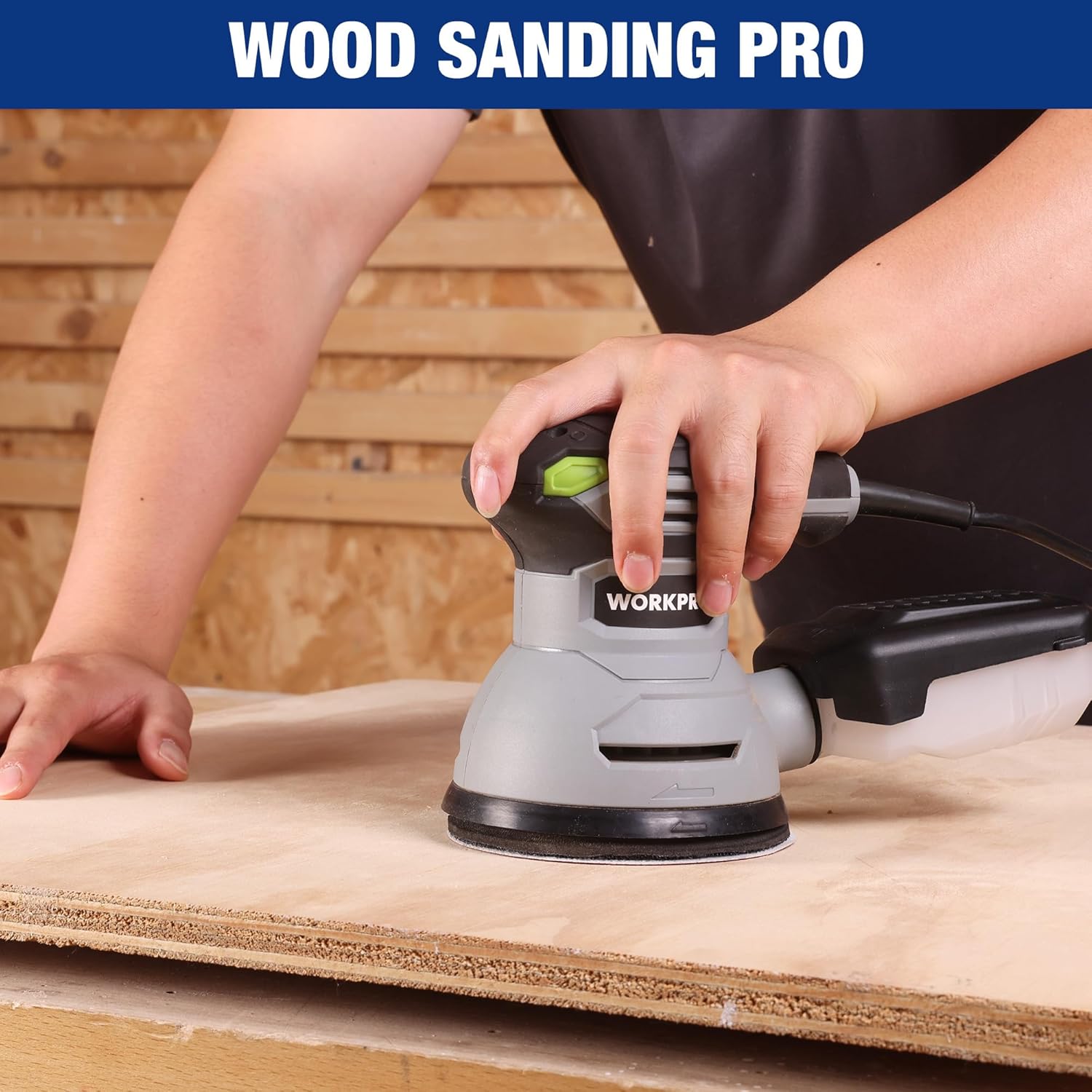 Orbital sander with a hook-and-loop sanding disc attached on the pad