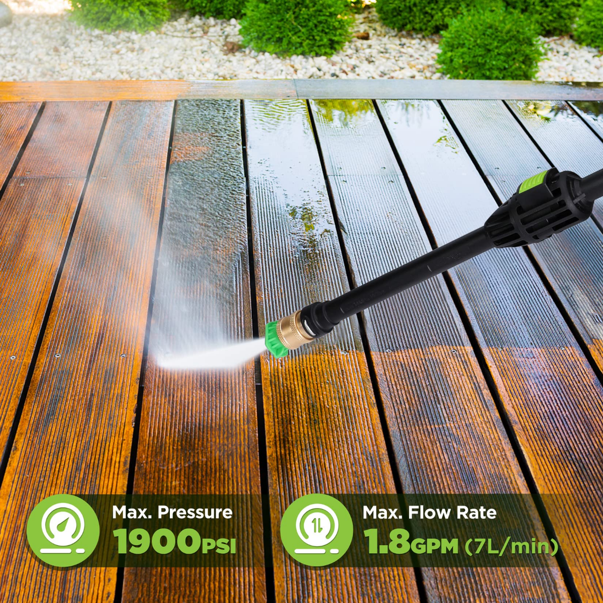 Pressure washer spray wand with green nozzle tip cleaning a wooden deck surface