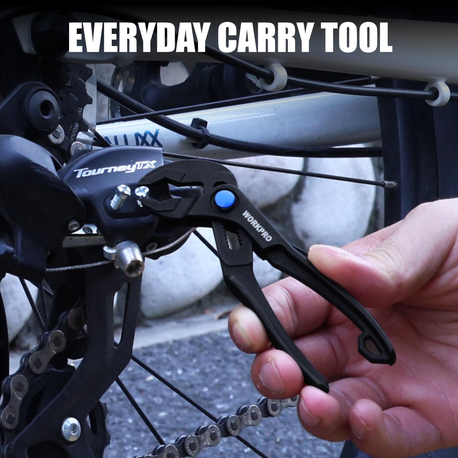 WORKPRO mini water pump plier in hand, gripping a bicycle chain