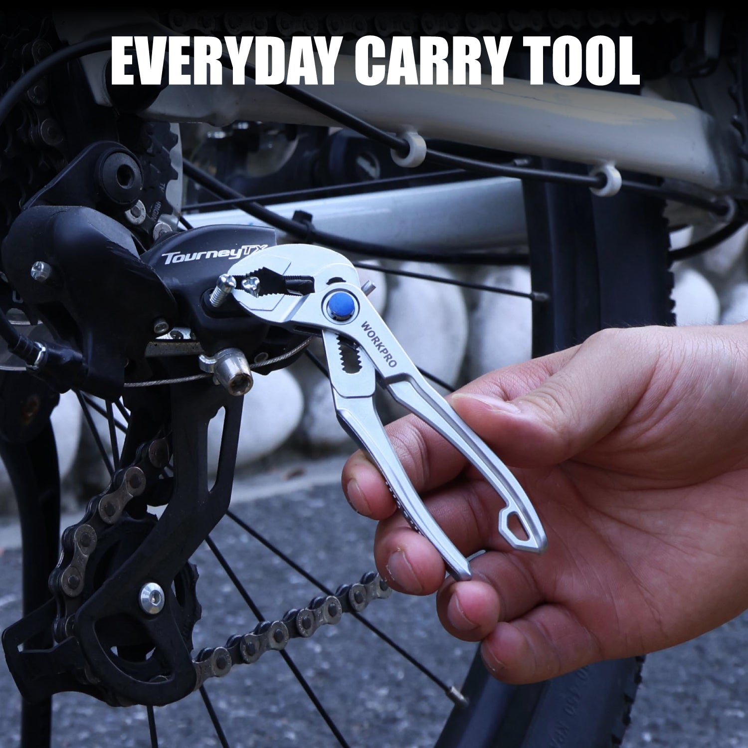 Water pump plier in use on a bike frame, silver tool with blue adjustment knob