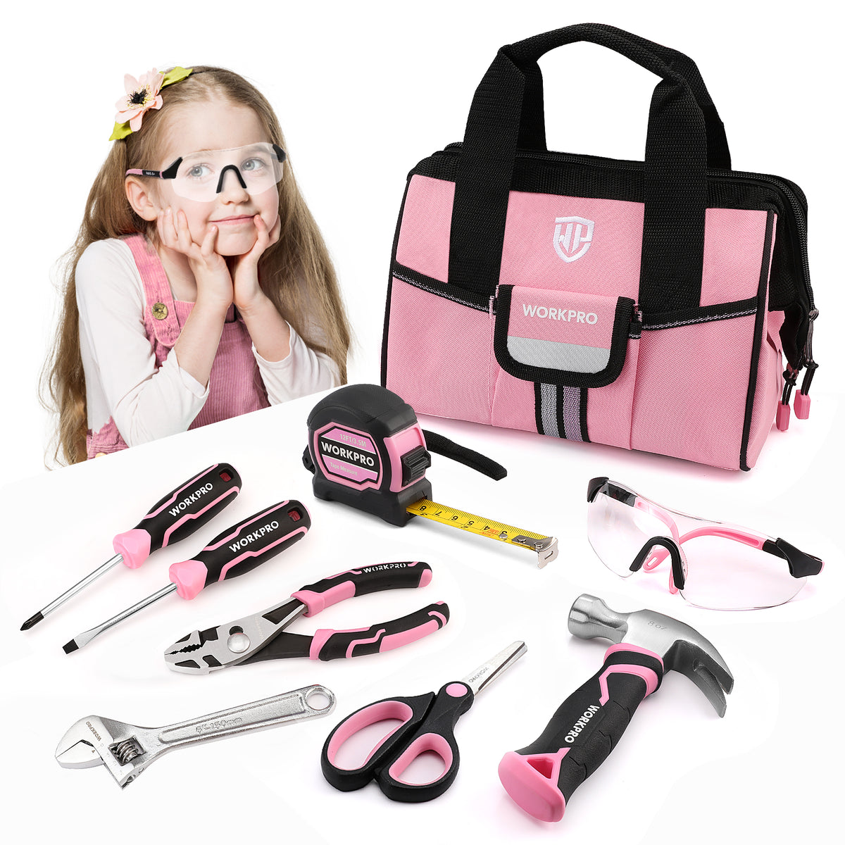Pink and black WORKPRO toy tool set with a matching tool bag, shown with a young girl wearing safety glasses on a white background. The set includes a tape measure, wrench, pliers, screwdrivers, hammer, and scissors.
