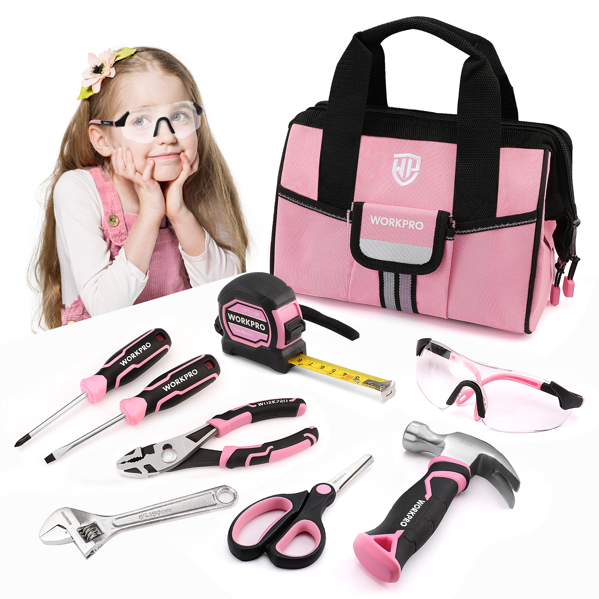 Pink and black WORKPRO toy tool set with a matching tool bag, shown with a young girl wearing safety glasses on a white background. The set includes a tape measure, wrench, pliers, screwdrivers, hammer, and scissors.