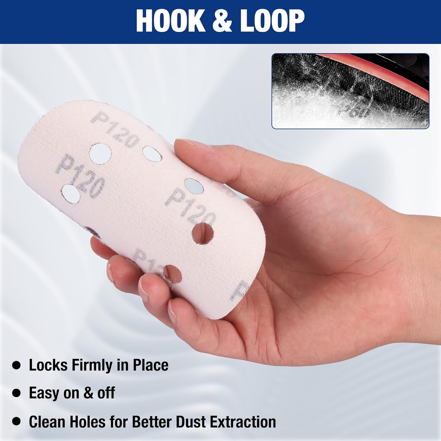 Hand holds a maroon 5-inch hook-and-loop sanding disc with 8 holes for dust extraction.