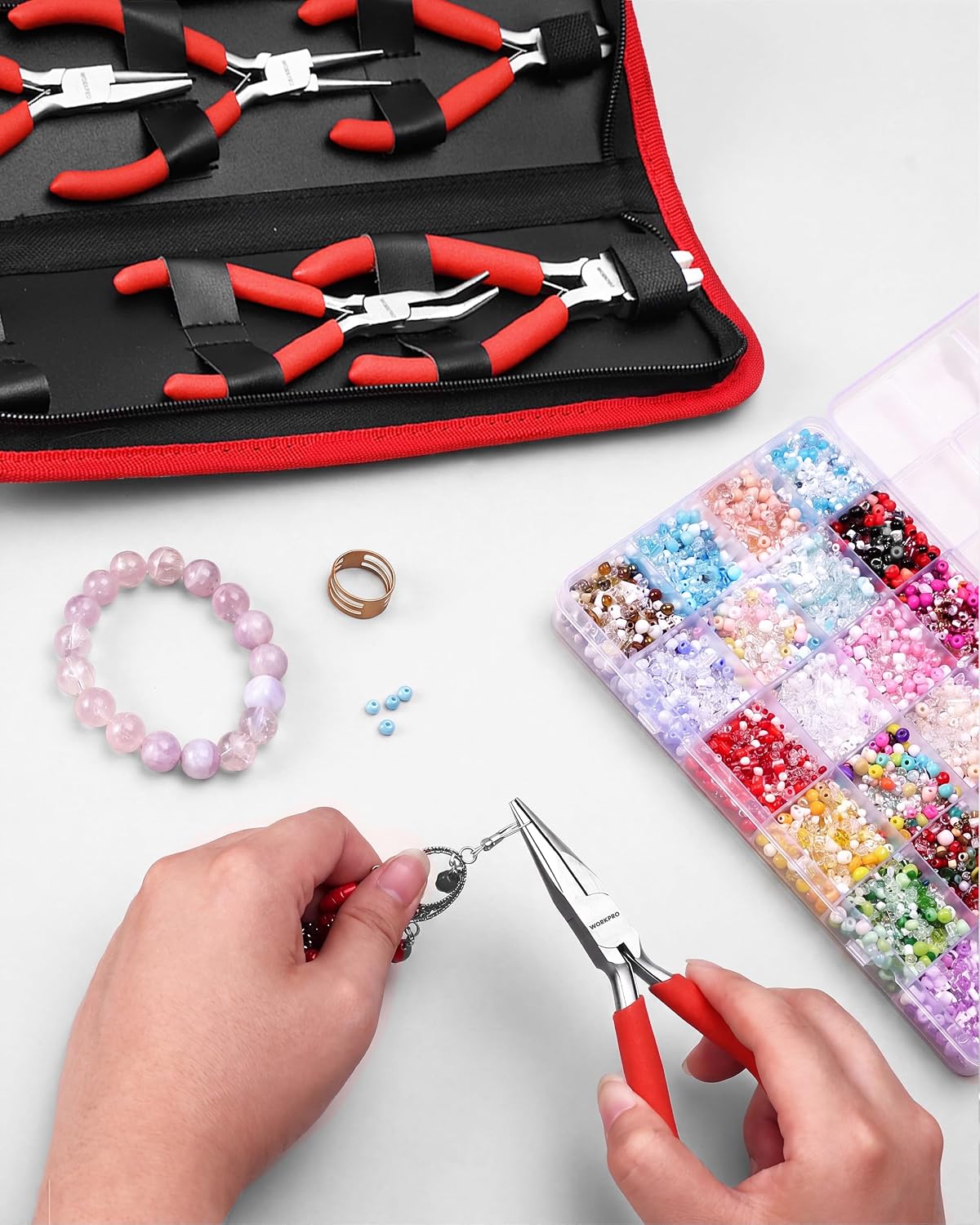 WORKPRO jewelry pliers set with pouch, red and black handles, shown with pliers laid out on a zip case