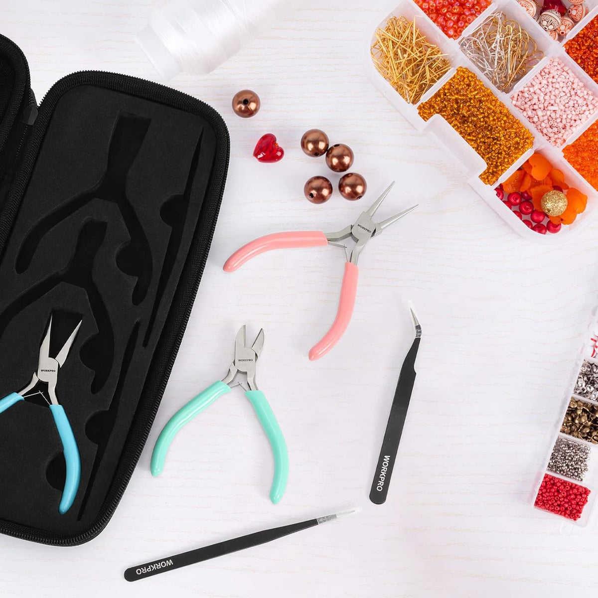Jewelry pliers kit in black zip case with teal, pink, and blue-handled tools