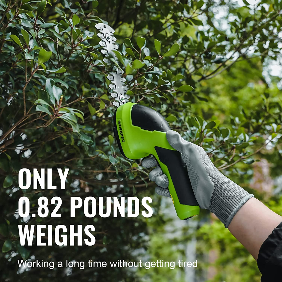 2-in-1 handheld electric trimmer, green body with black handle, shrub blade in use