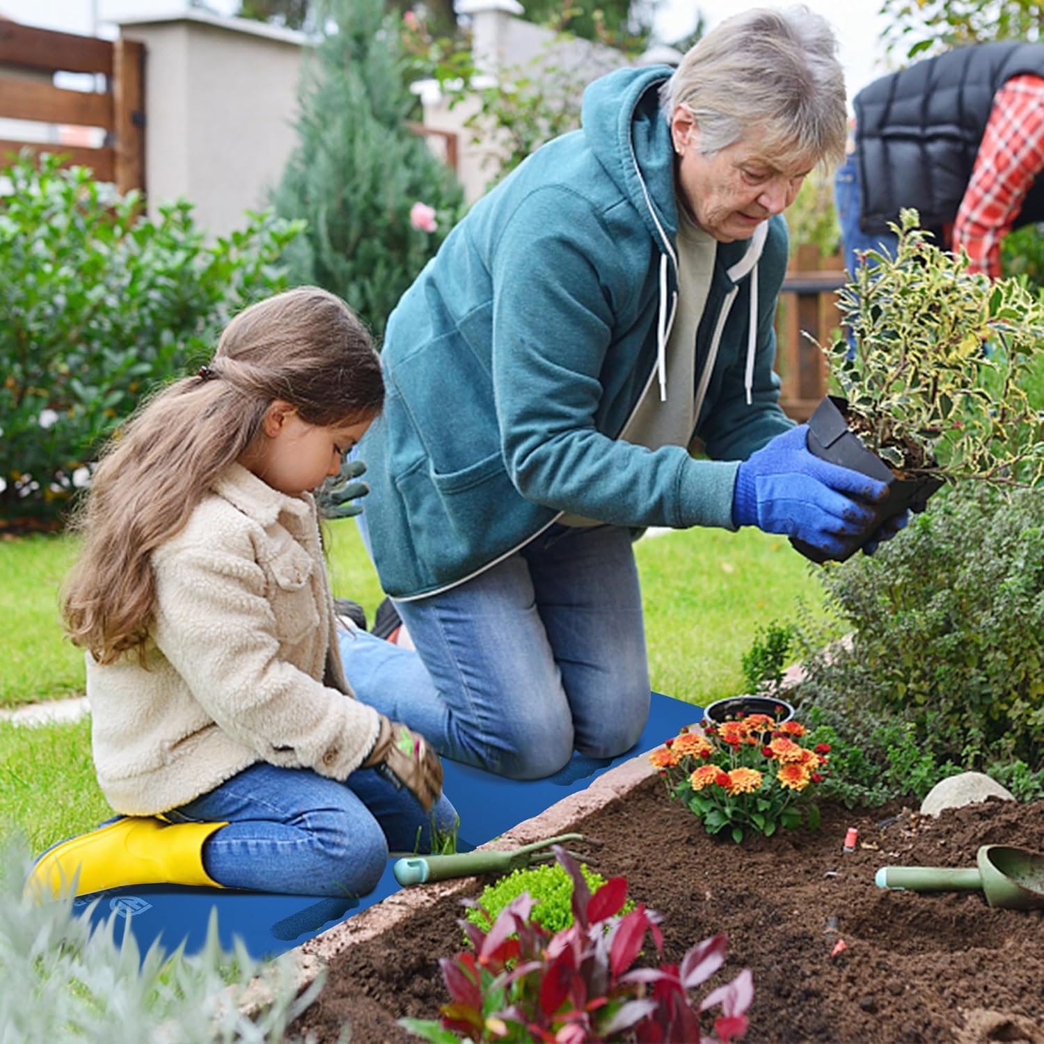 Extra thick foam kneeling pad in blue used for gardening while kneeling