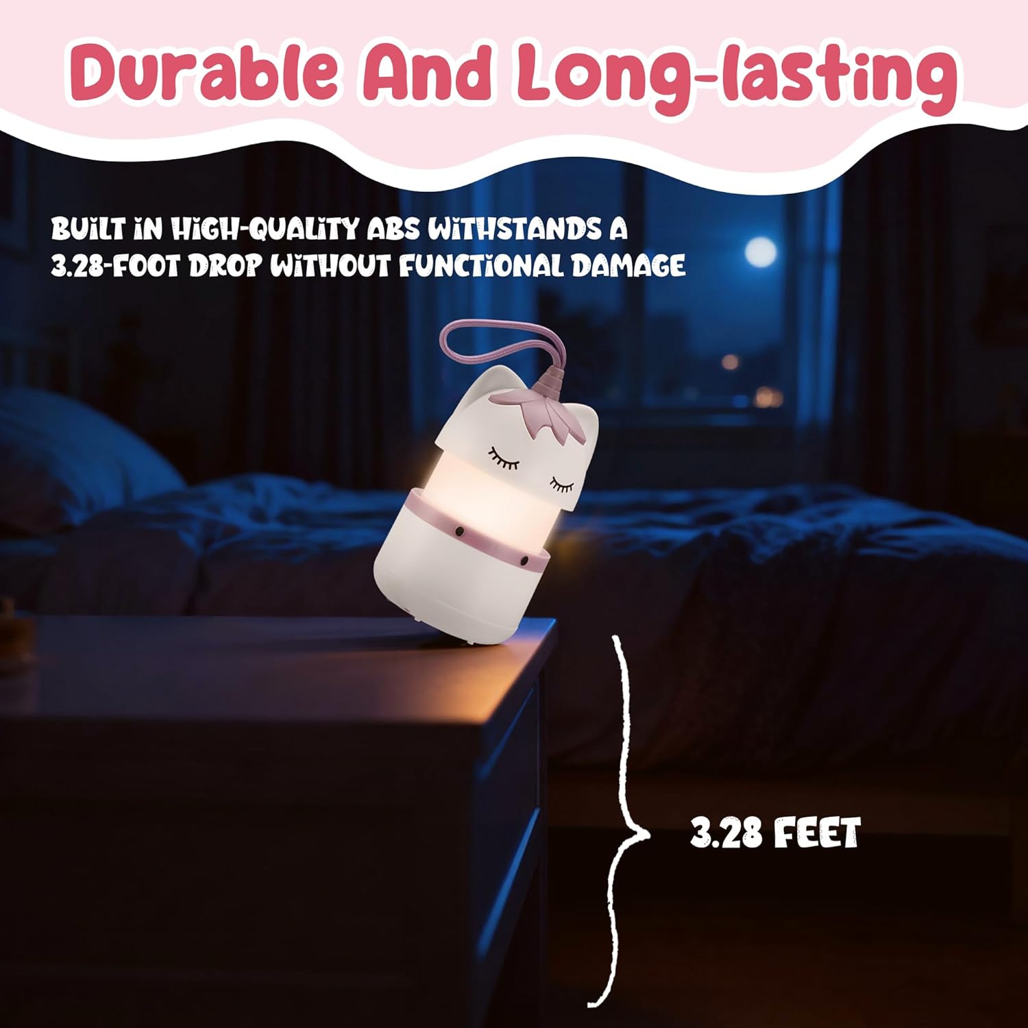 Unicorn kids lantern on a table with lanyard; shown for drop durability claim, warm light