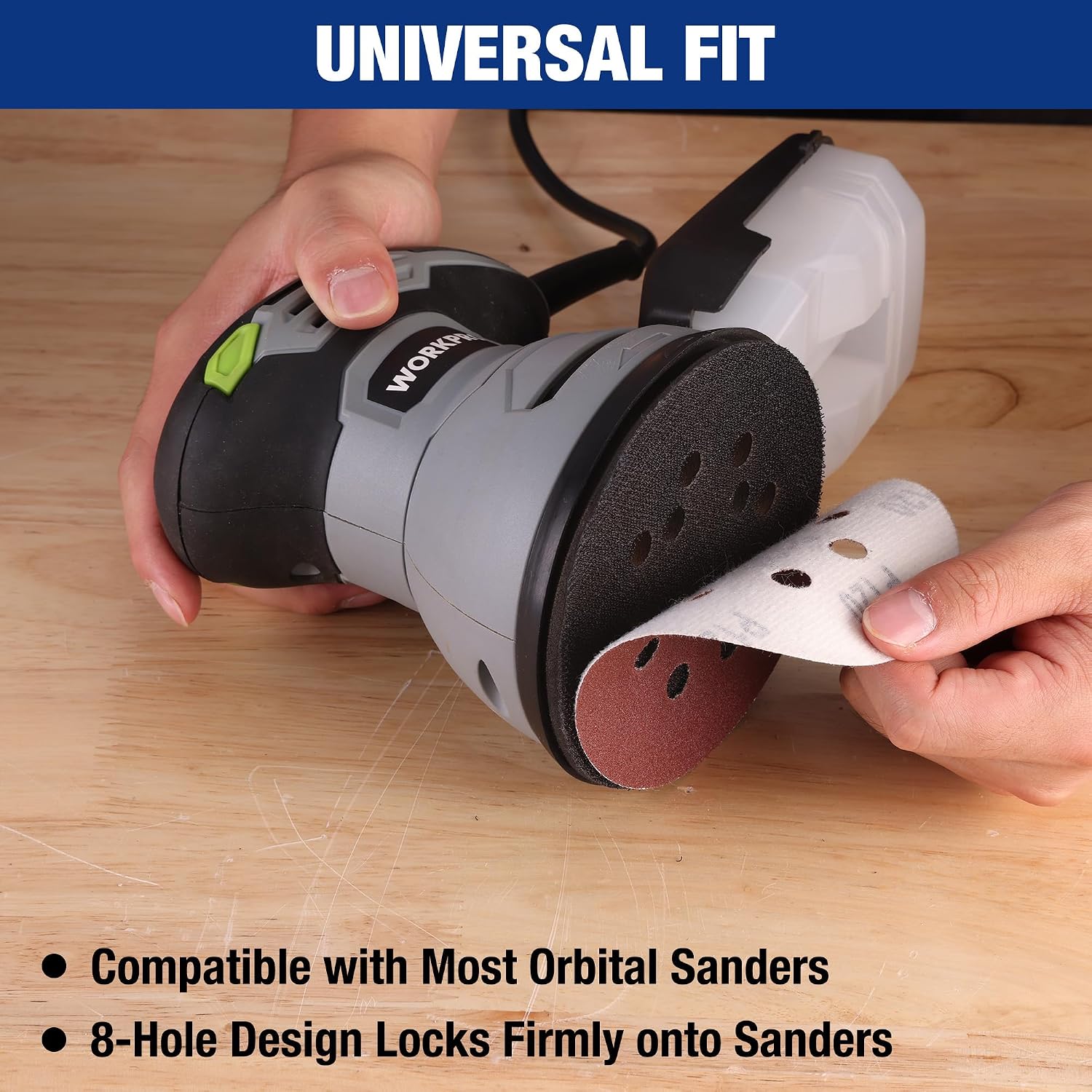 Sanding disc attached to a random orbital sander, maroon 8-hole hook-and-loop backing.