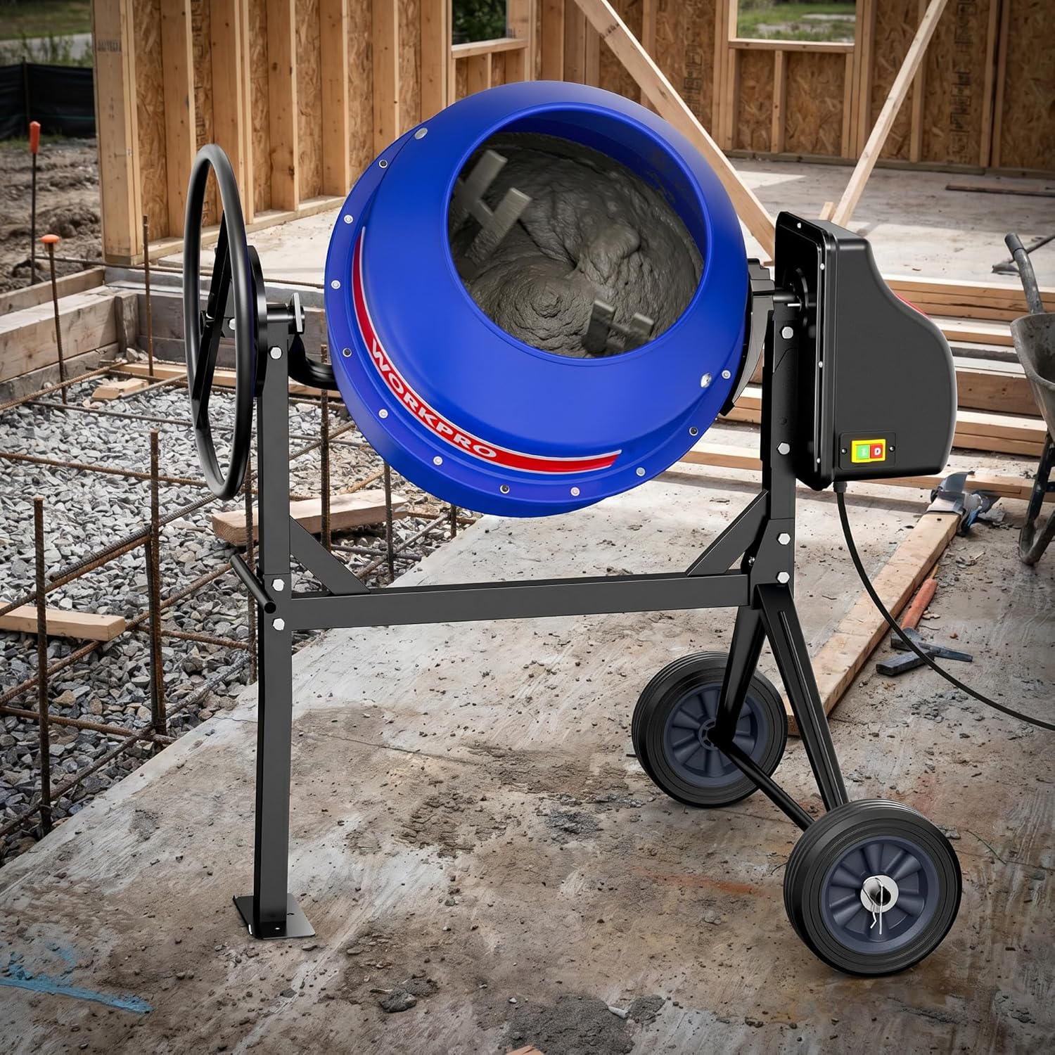 Portable concrete mixer in use with open blue drum, motor box, and four wheels
