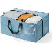 Dusty blue zip-top moving bag with black handles, holding folded clothes