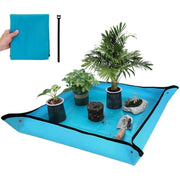 Blue waterproof square repotting mat with raised rim, holding multiple potted plants
