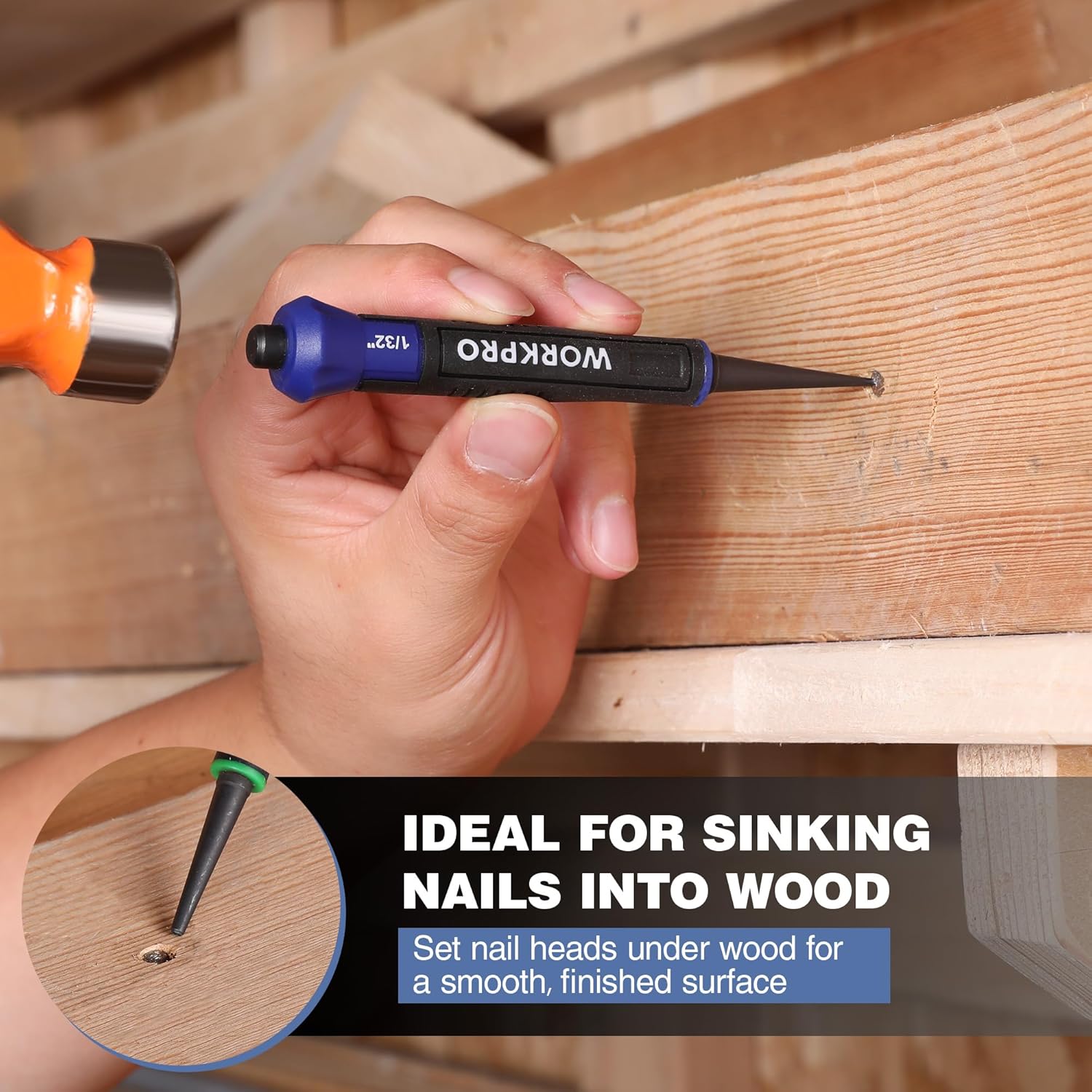 Hand holding a blue WORKPRO nail punch tool over a wooden board, pointed setter tip visible