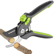 Bypass pruning shears cutting a small branch with black handle and green accents