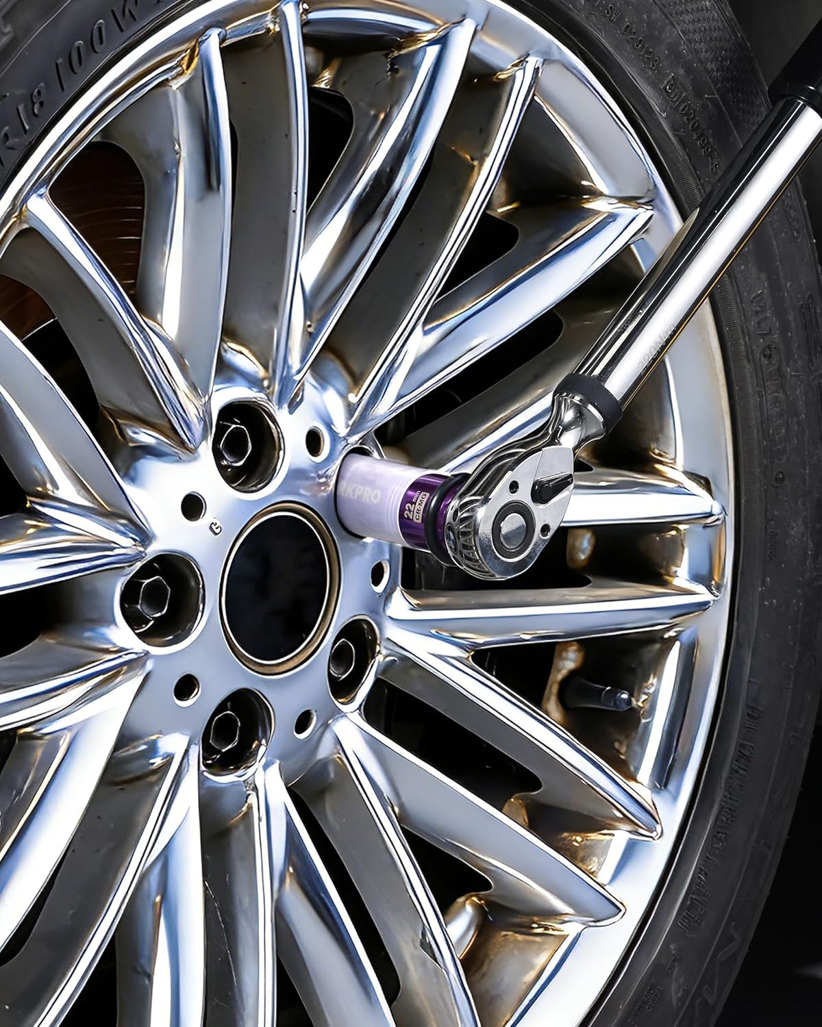 Purple 22mm 1/2 in drive lug nut socket fitted on a wheel lug