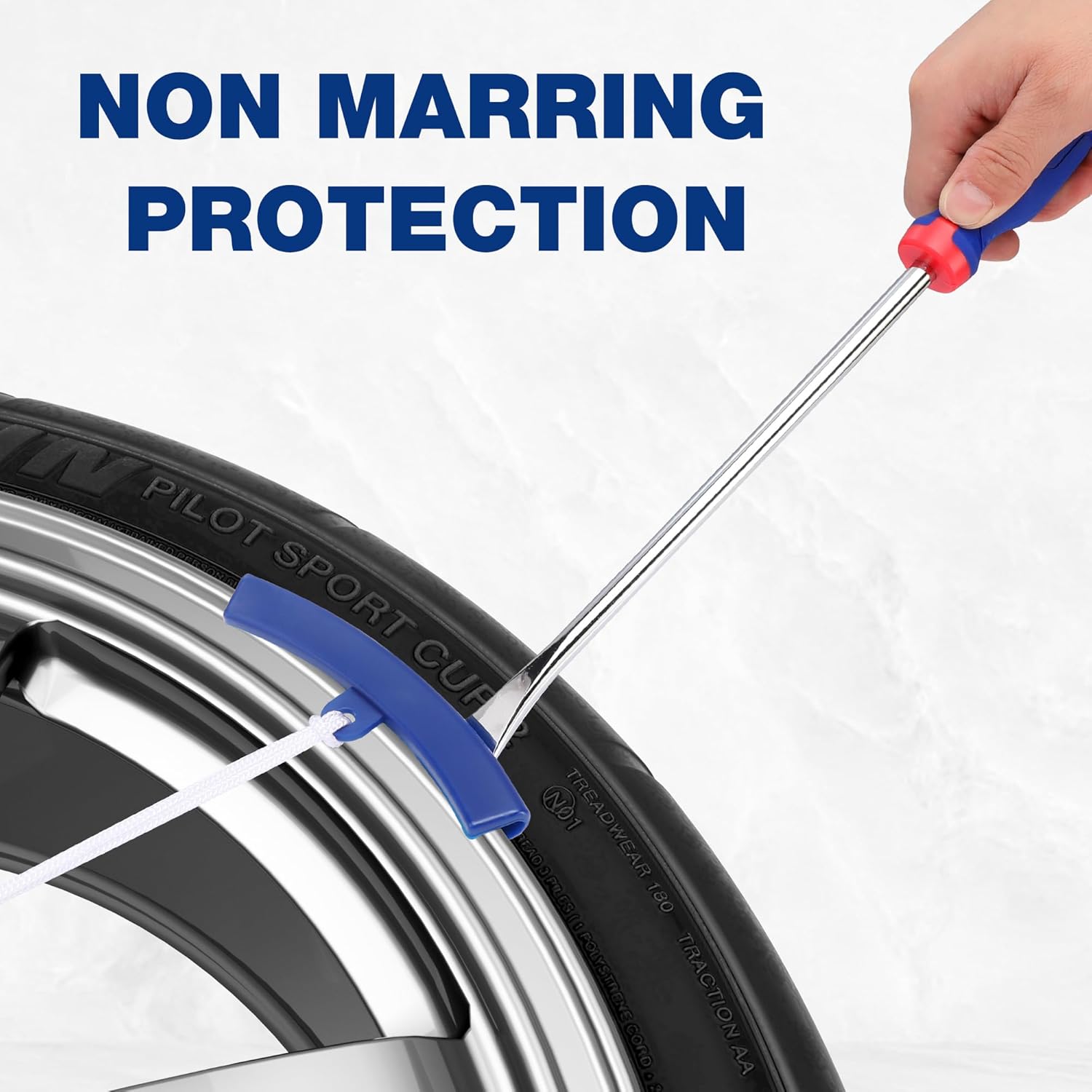Red-and-blue tire spoon lever with non-marring rim protector clip on a wheel