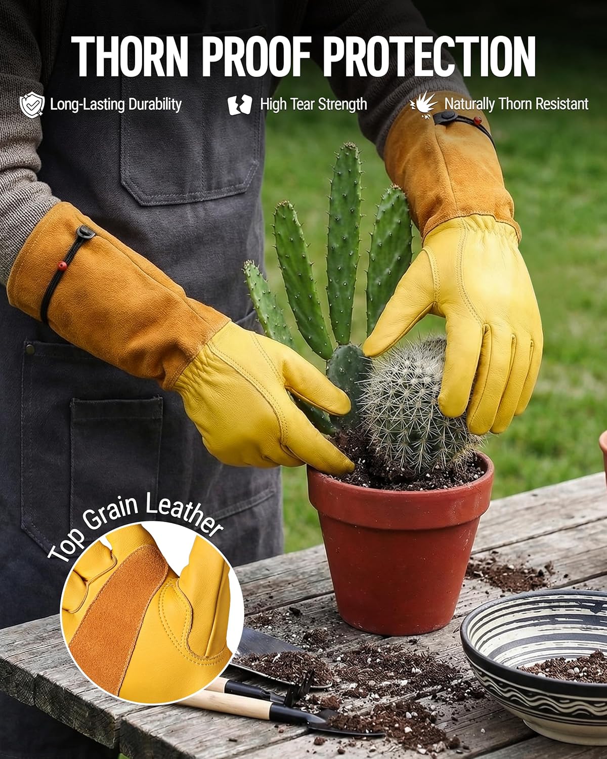 Pair of long yellow leather gardening gloves with reinforced tips and black wrist strap