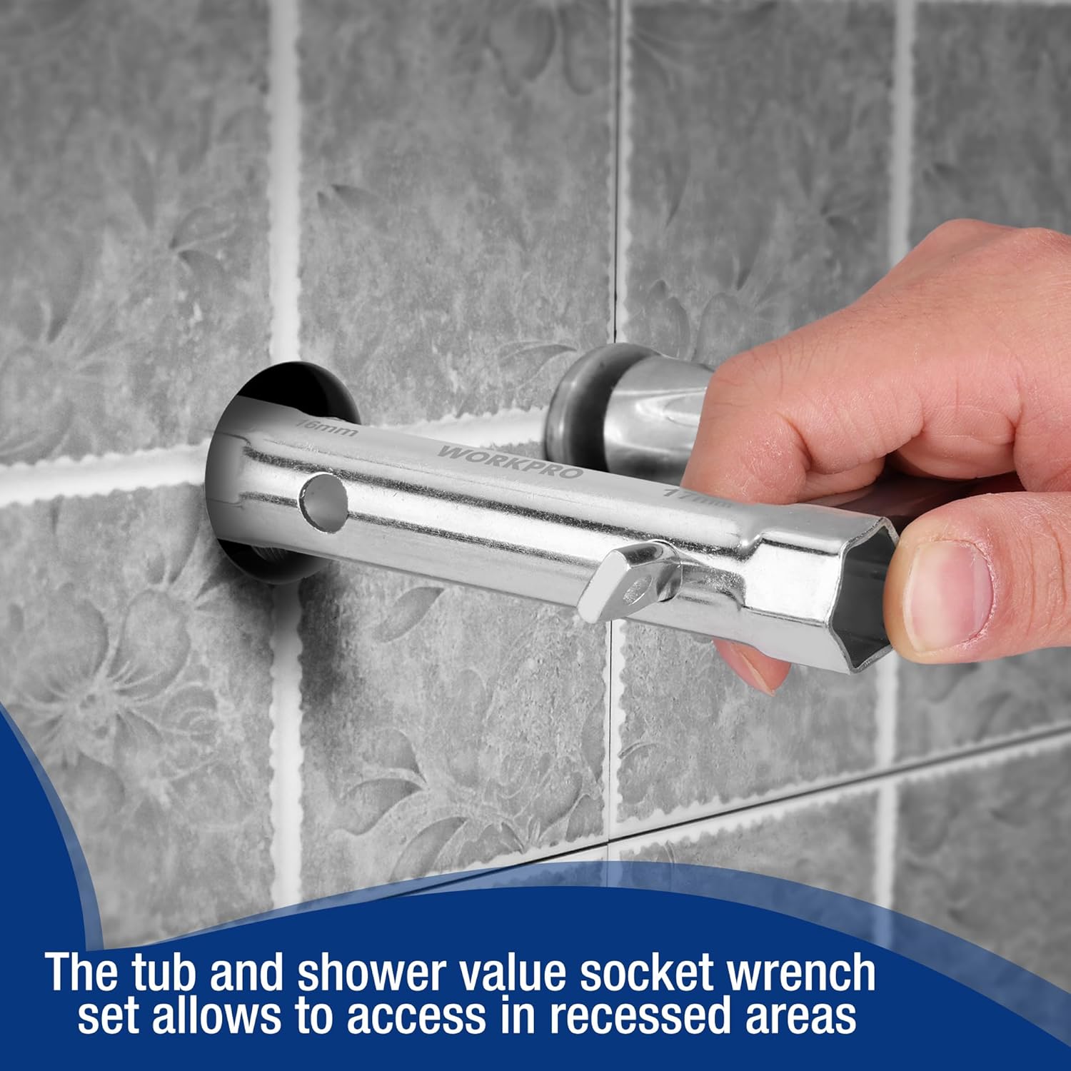 Hand holding a chrome shower valve socket wrench tool against a tile surface.