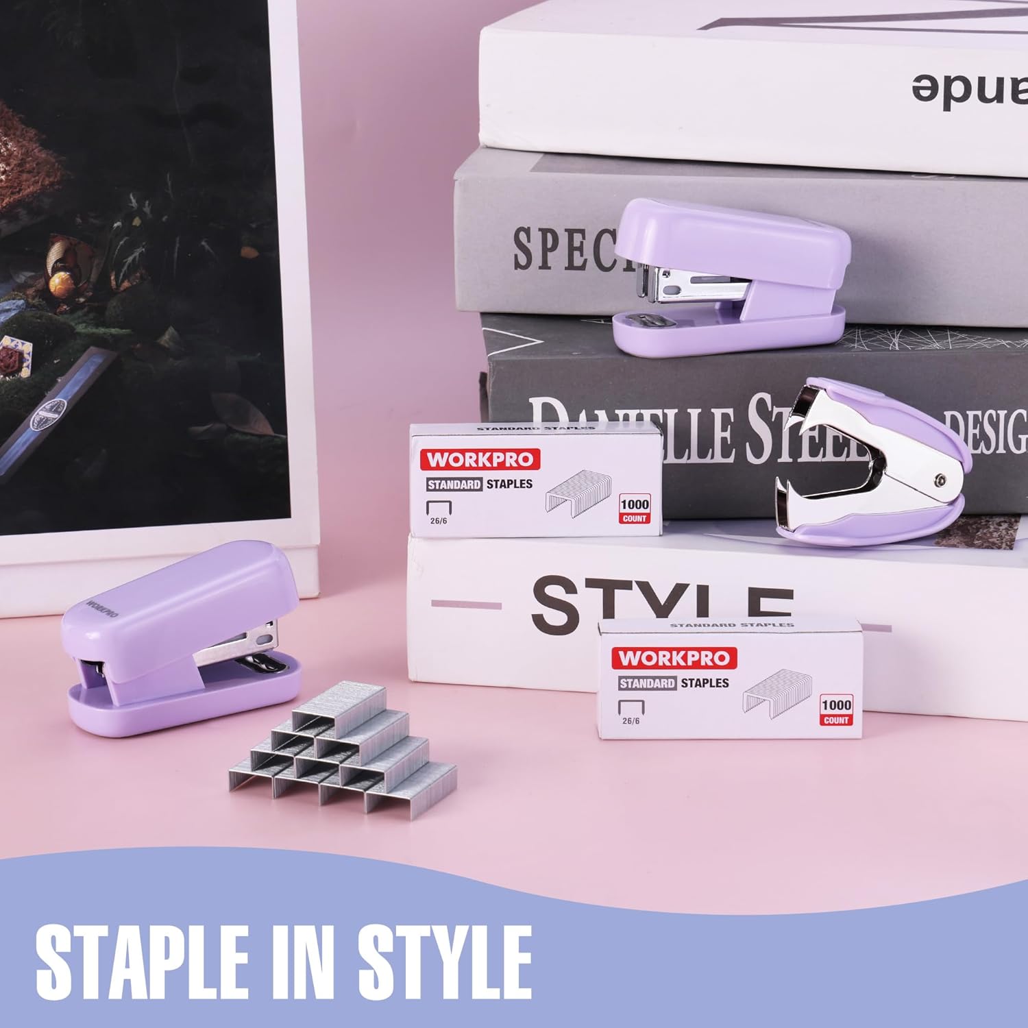 Purple mini stapler and staple boxes on a desk, with extra staples piled nearby