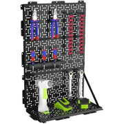 Foldable black metal pegboard with two panels open on stand, round hole grid and hooks