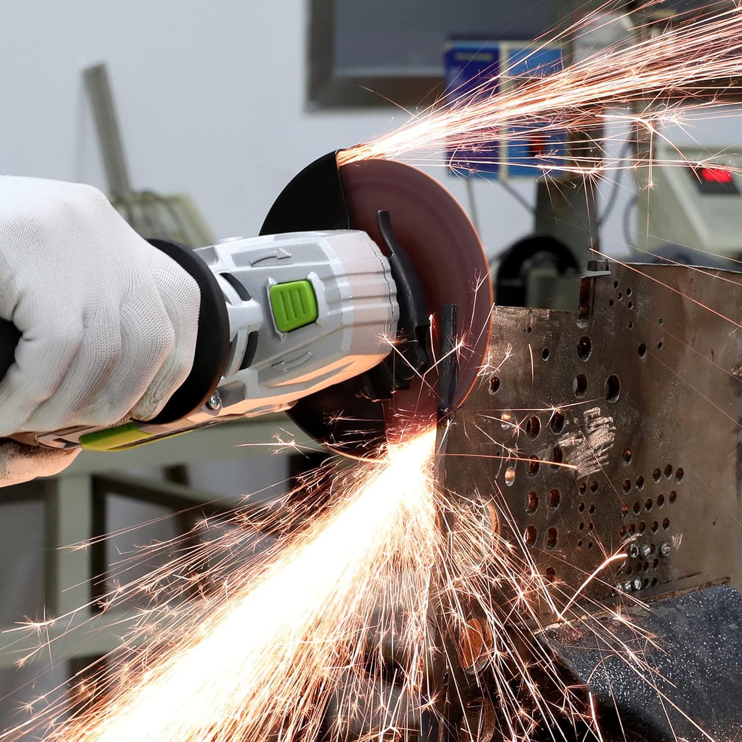Angle grinder using a WORKPRO cut-off wheel on metal sheet with sparks