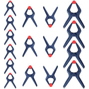 Assorted blue spring clamps with red jaw tips arranged in a set