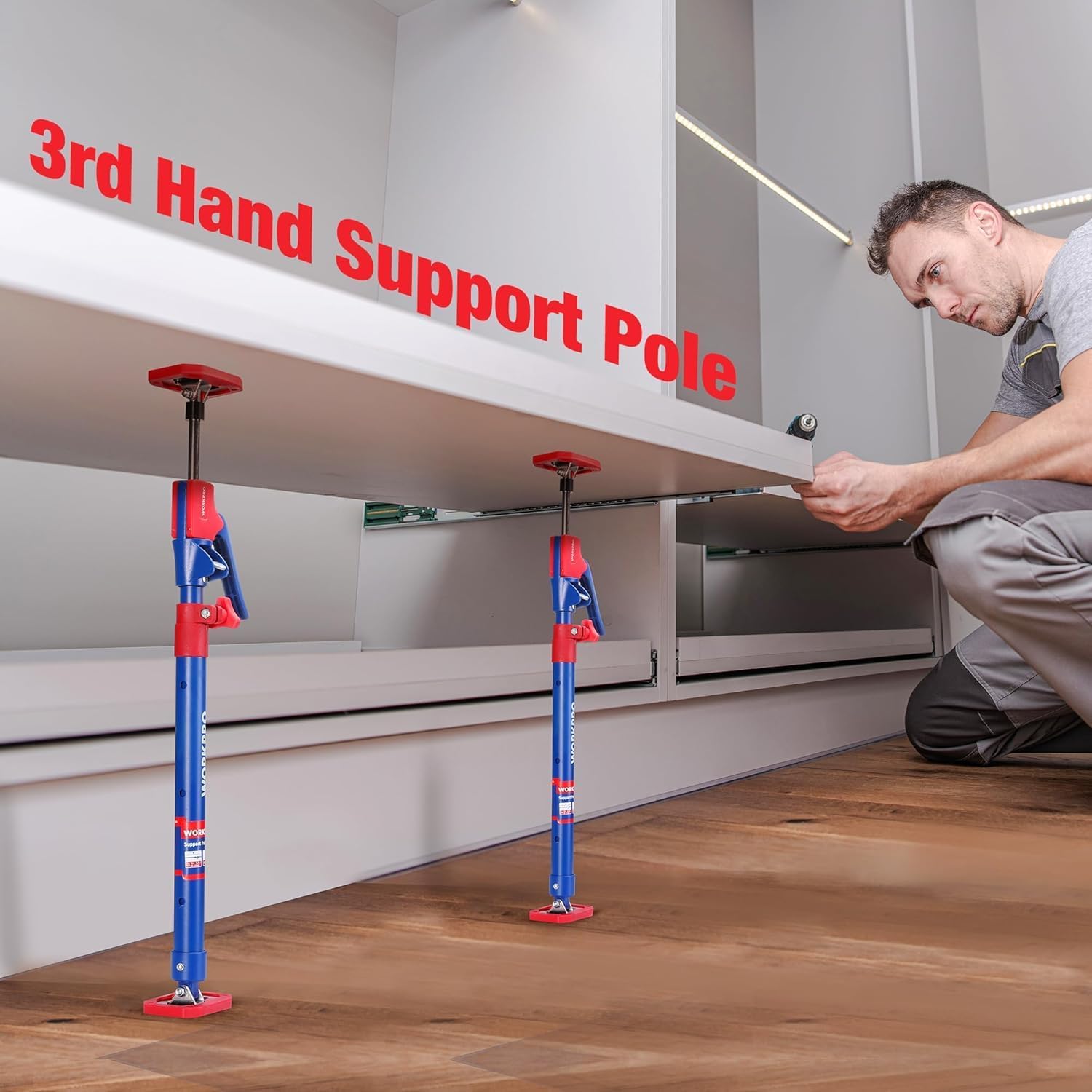Two steel telescopic support poles with red top pads supporting cabinet shelves