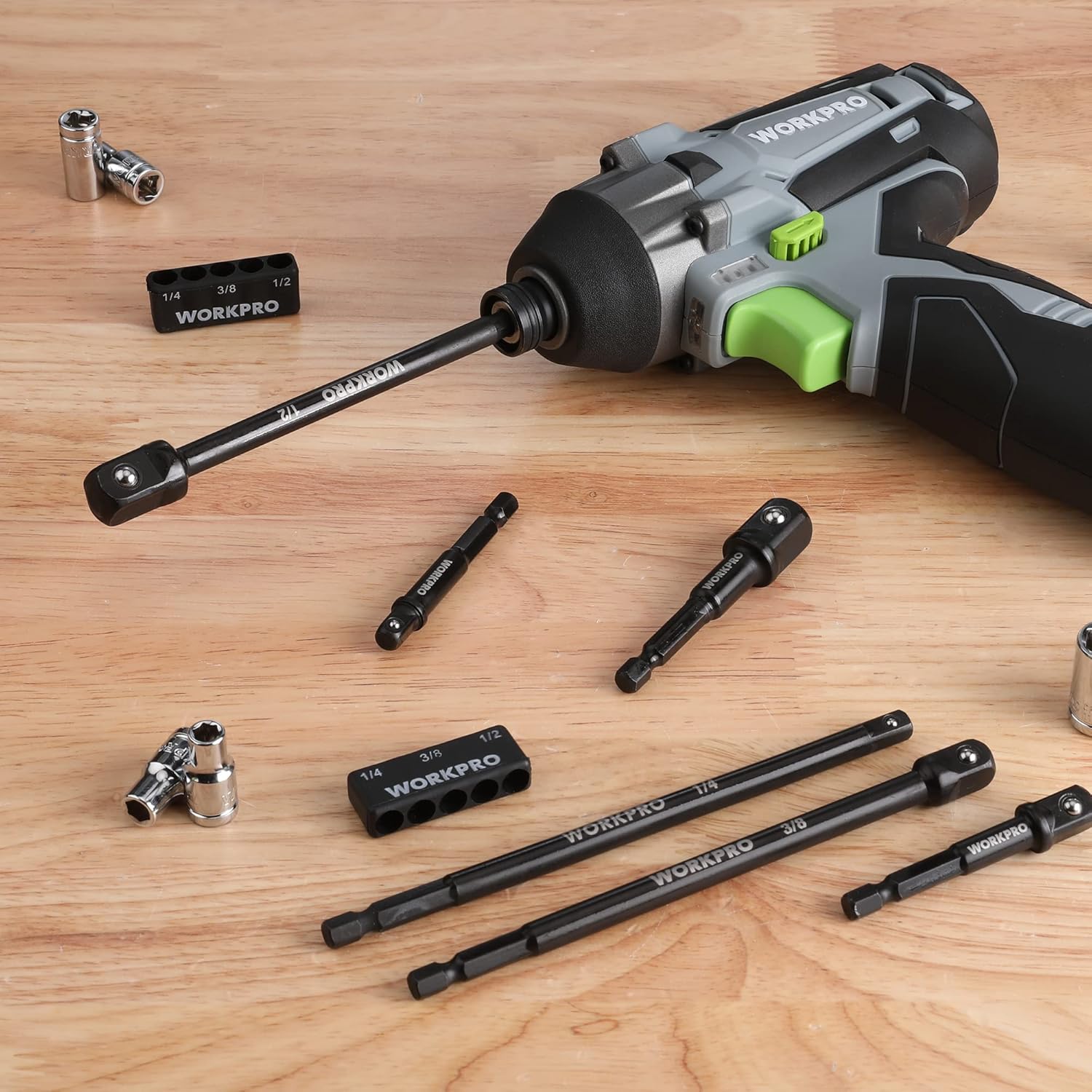 Black socket adapter extensions laid out on a workbench with hex-shank ends