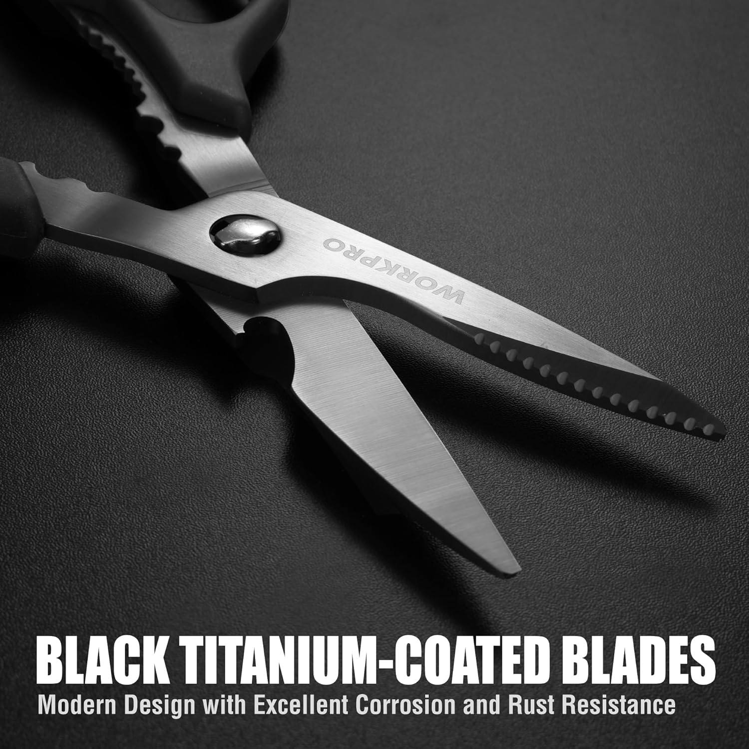 Close-up of kitchen scissors showing black titanium-coated blades and serrated edge