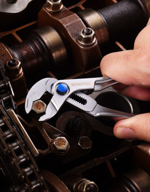 Metal tool and fasteners with WORKPRO markings, innovation and quality visible on a secure workbench