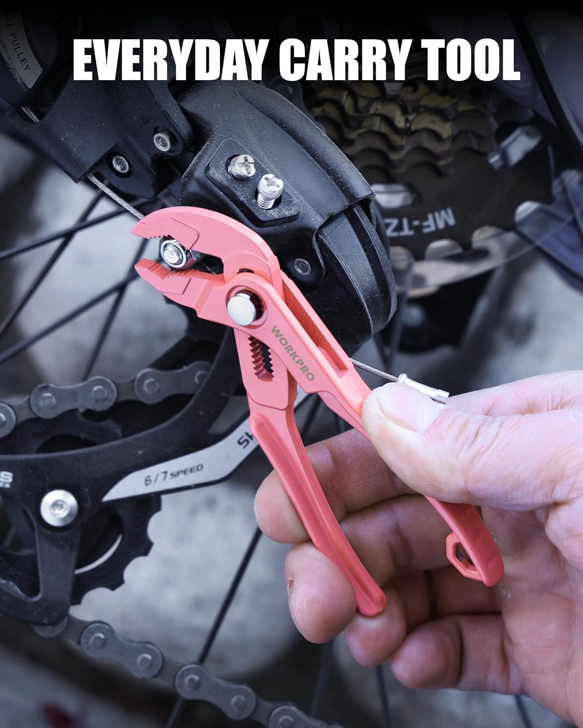 Pink mini water pump pliers being used on a metal bike component