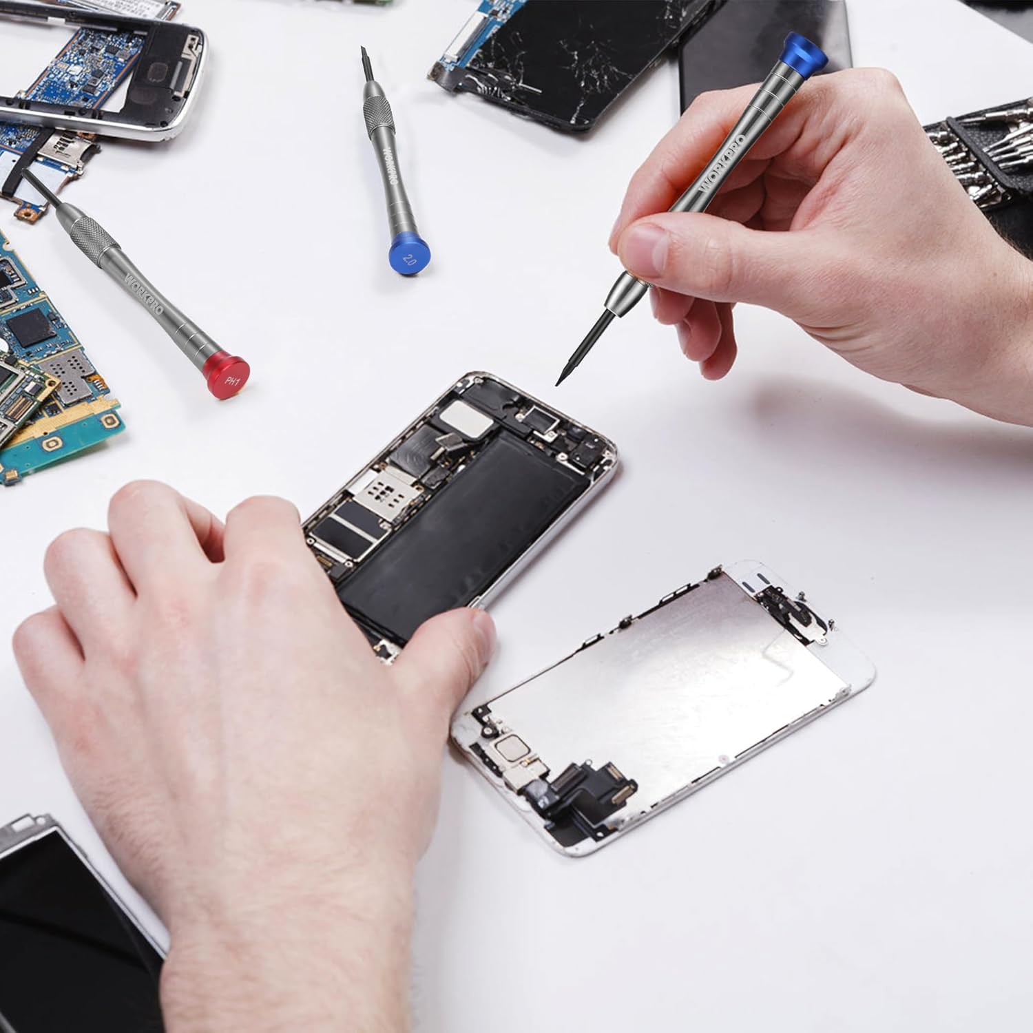 Magnetic precision screwdriver being used to open a small electronic device with removable components