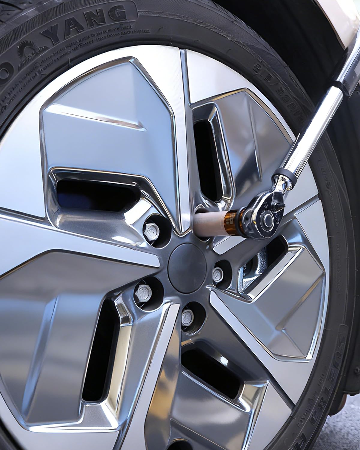 Impact lug nut socket fitted on a wheel lug nut on a chrome wheel