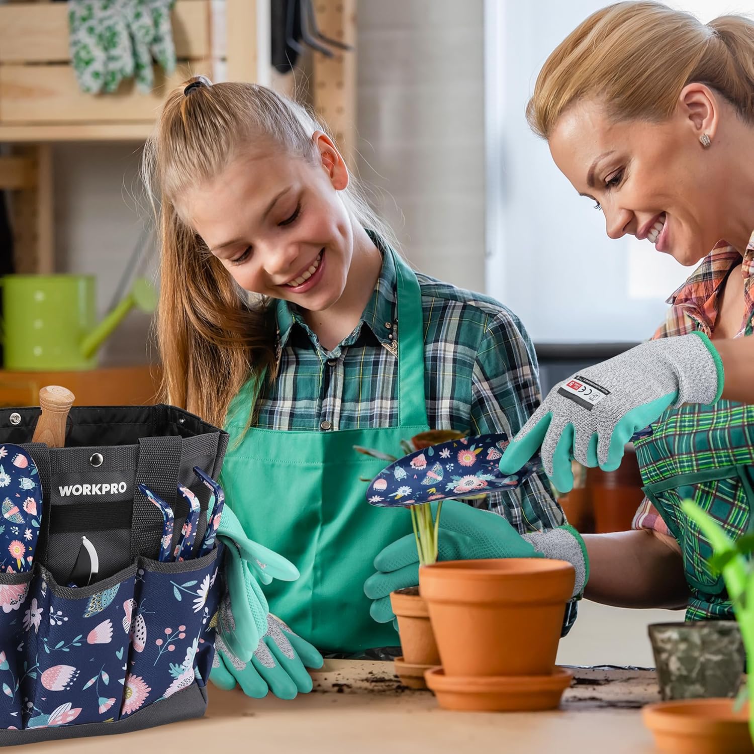 Garden tool bag with blue floral pouches and mint gloves for planting tasks indoors