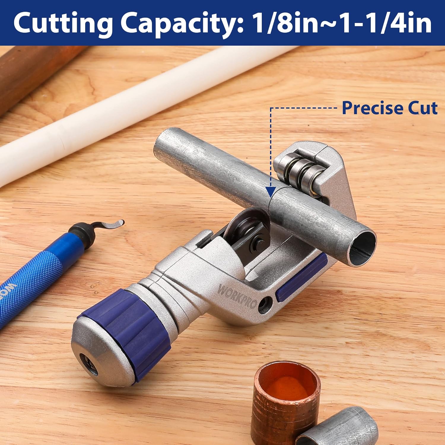 Tubing cutter cutting copper pipe end on wood, with rotating cutting wheel
