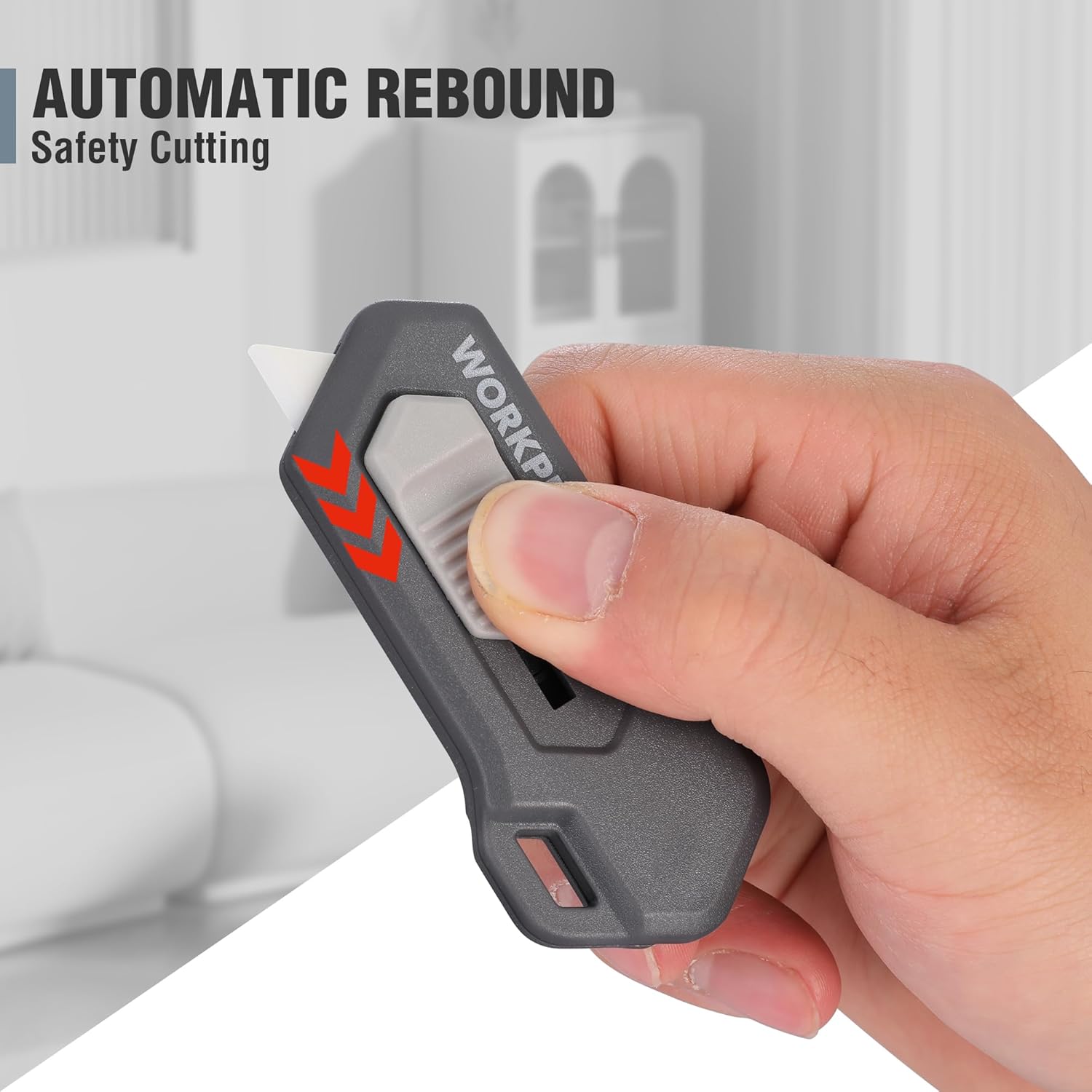 Retractable safety box cutter showing automatic rebound blade guard in hand