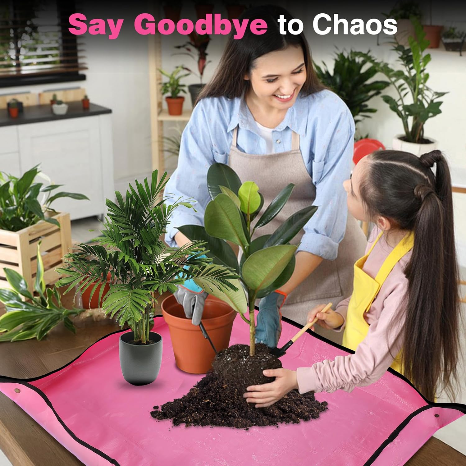 Pink potting mat with black border laid flat under potted plants during transplanting