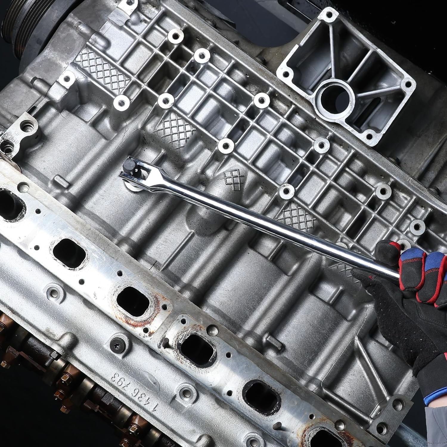 Breaker bar with chrome shaft and socket-drive connection, used on vehicle components