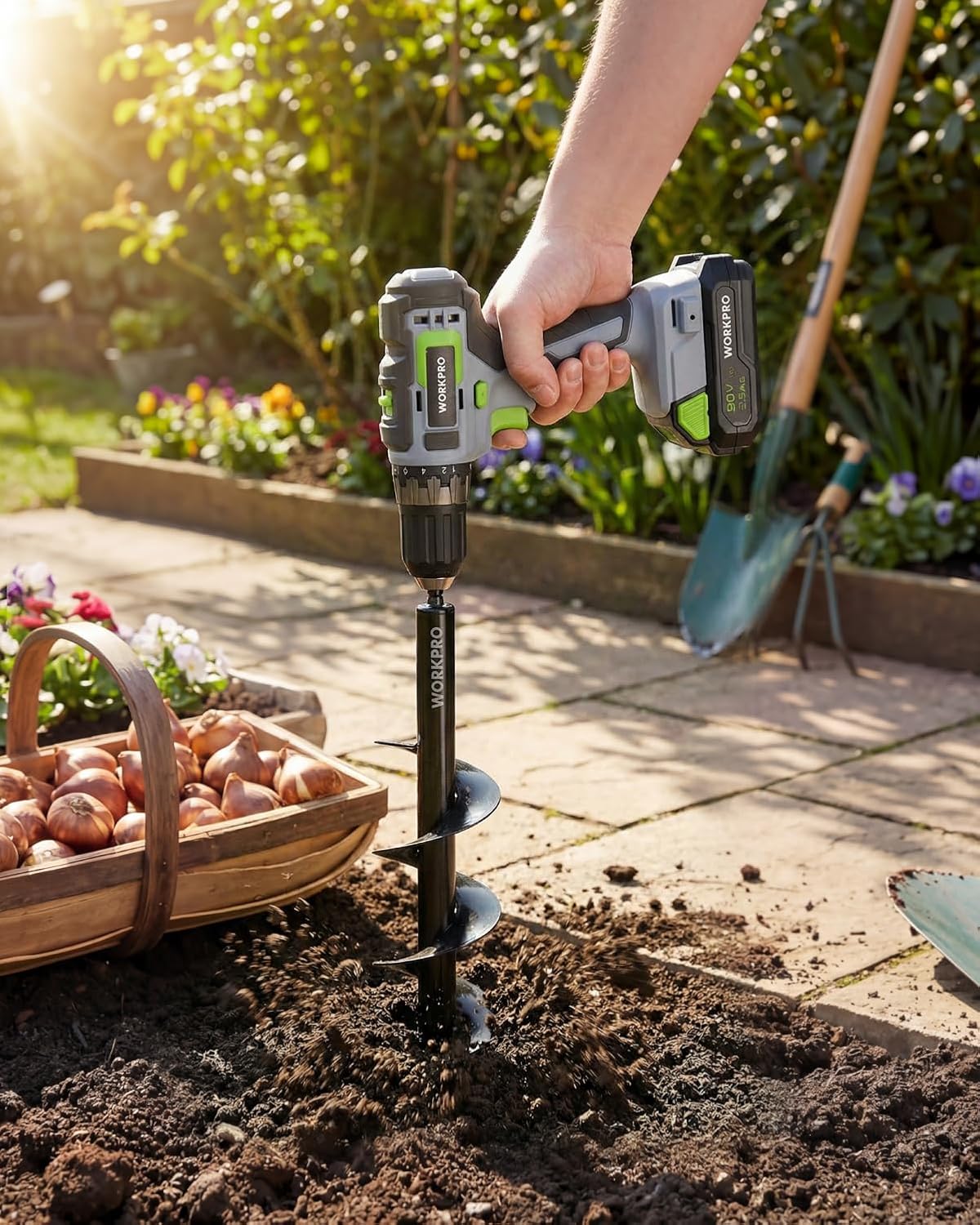 Garden auger drill bit set with spiral screw tip, inserted into soil for planting holes