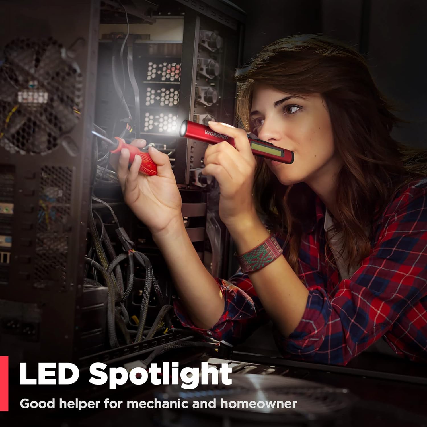 Red WORKPRO pen light held in hands with beam from clear front lens