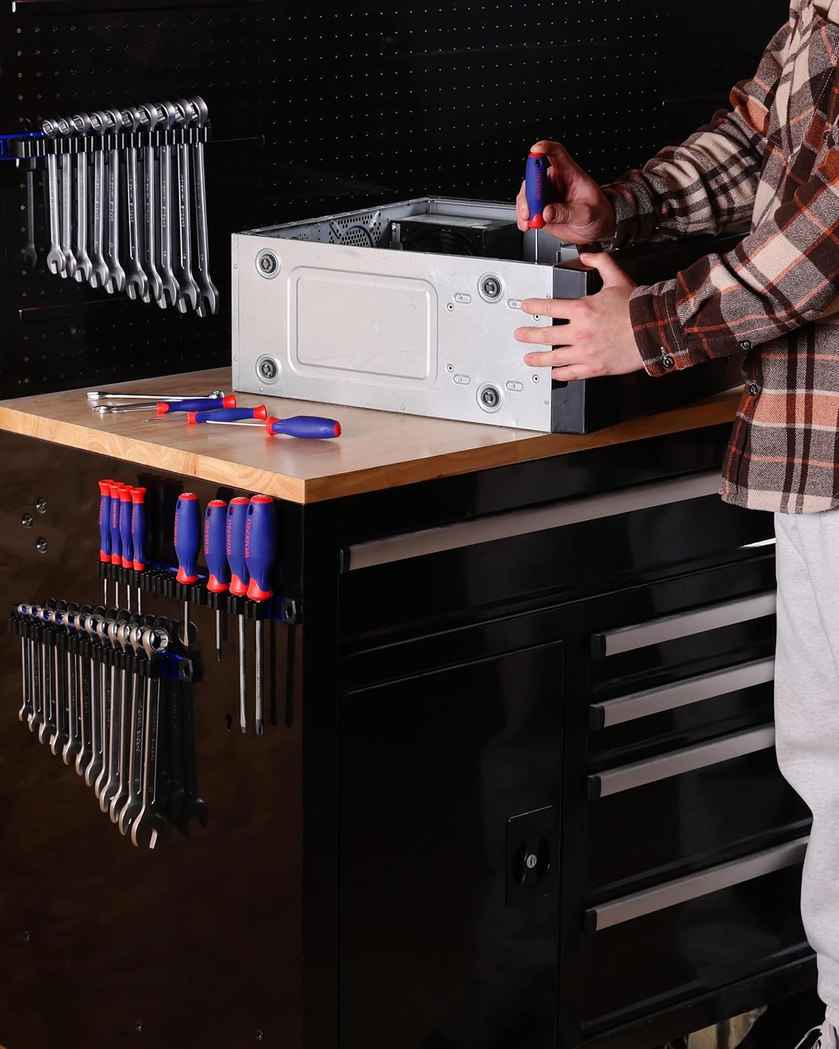 Magnetic tool organizer rails mounted on a workbench with tools held in slots
