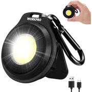 Black COB keychain work light with carabiner, close-up of bright front lens