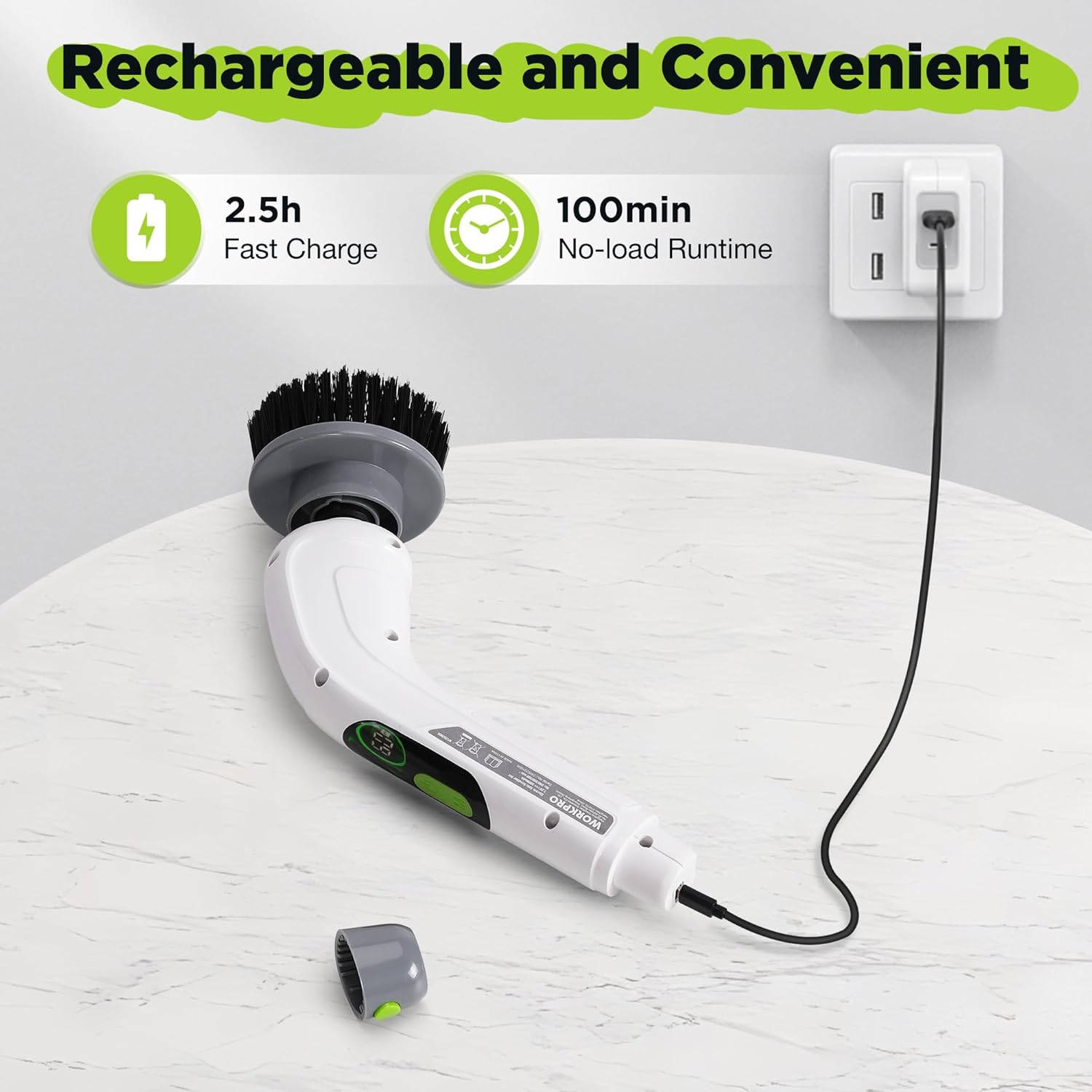 Rechargeable cordless spin scrubber lying on a surface with charging cable and dock