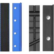 Assorted vise jaw pad inserts: black textured and blue pieces, plus two dark grooved pads