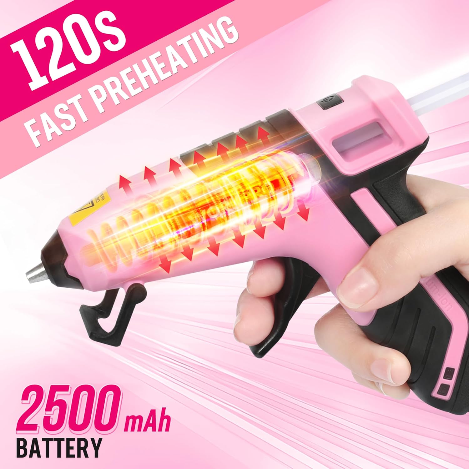 Pink cordless hot glue gun dispensing hot glue from the metal nozzle