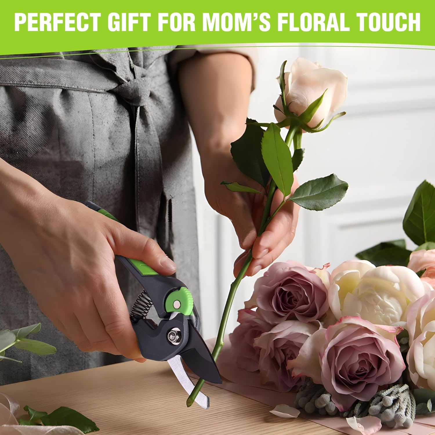 WORKPRO bypass pruning shears in hand near flowers, green handle and black blades
