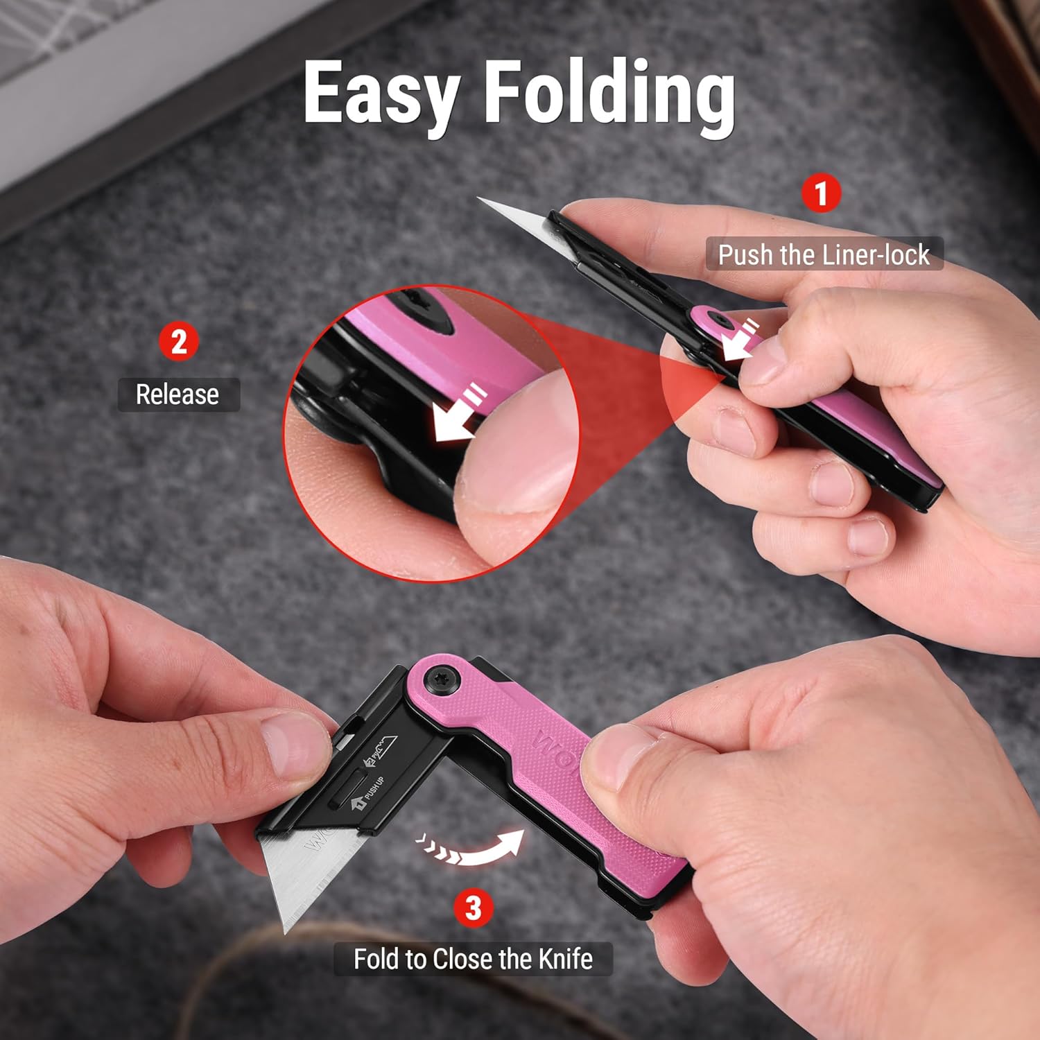 Pink folding utility knife held in hand with blade open and finger grip.